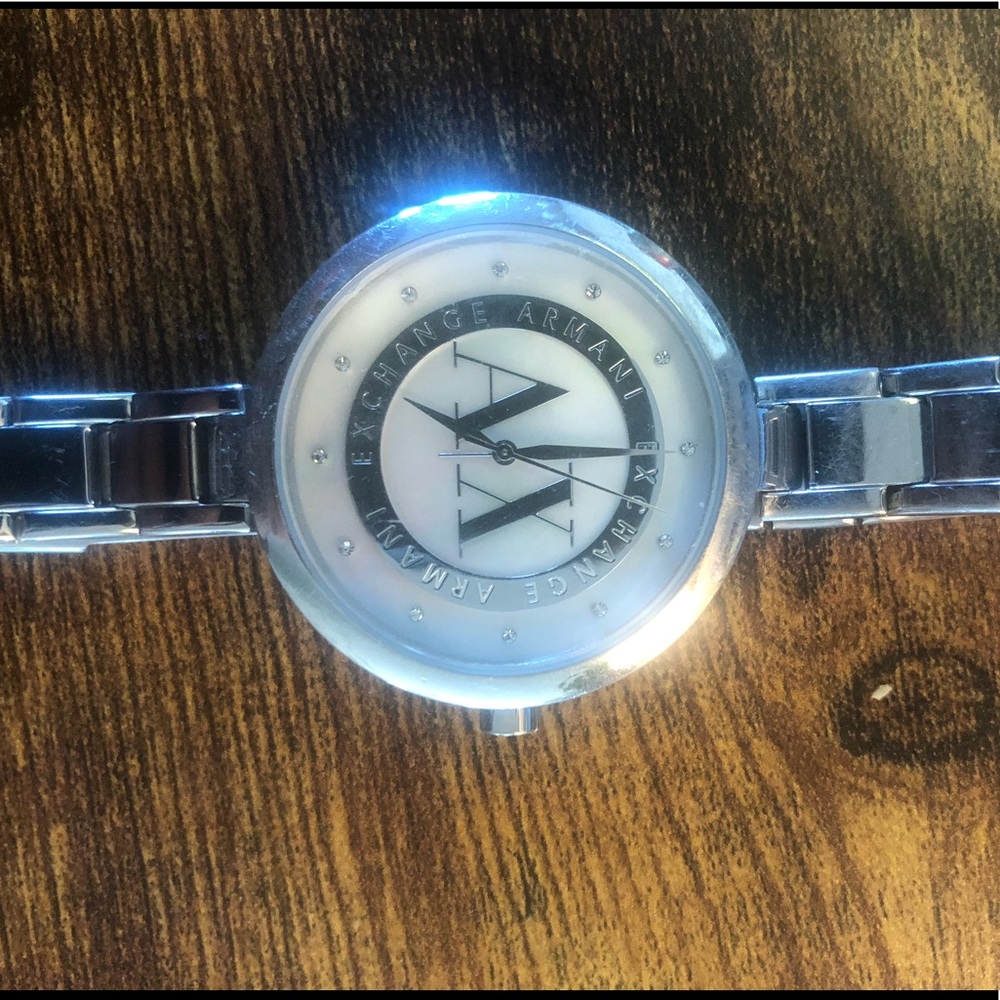 Silver with mother of pearl face watch